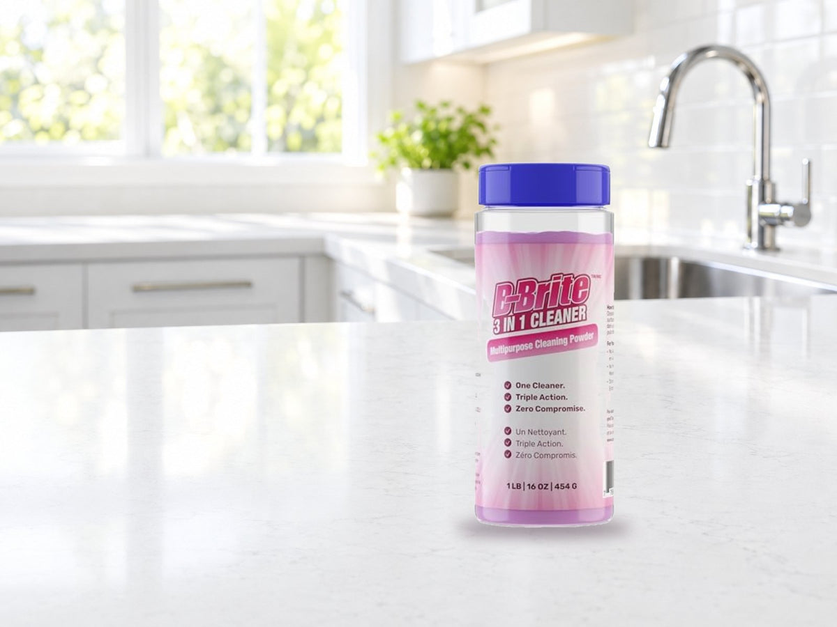 B-Brite 3 in 1 Cleaner canister on a white kitchen counter by the sink